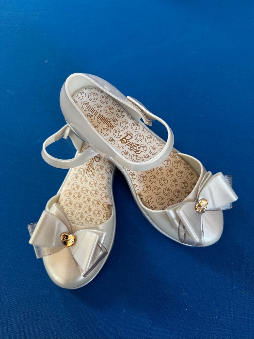 Barbie Pearl White Bow Strap Flats with Gold Heart
